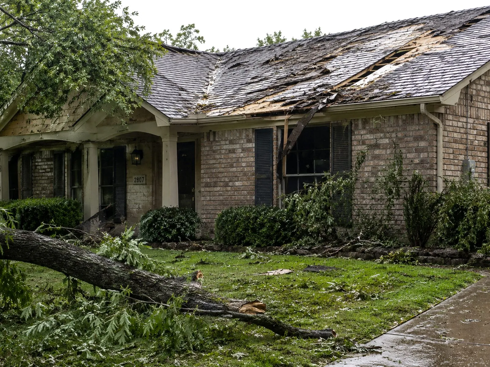 Storm-damaged roof before restoration